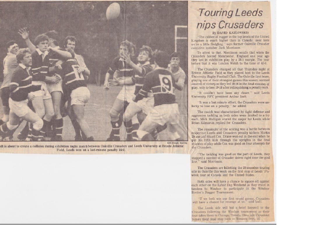 Black-and-white photograph of Crusaders Rugby Club players in action on a rugby field, with a newspaper clipping beside them.