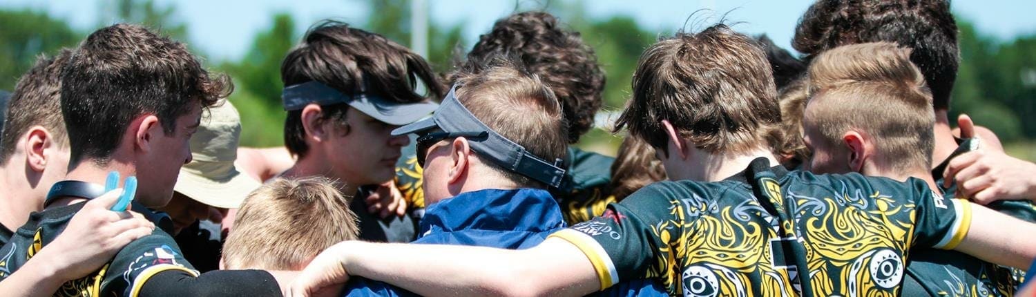 Crusaders Rugby Club players in blue and gold jerseys huddle together on the field in Oakville. Crusaders Rugby Club players in blue and gold jerseys huddle together on the field in Oakville.