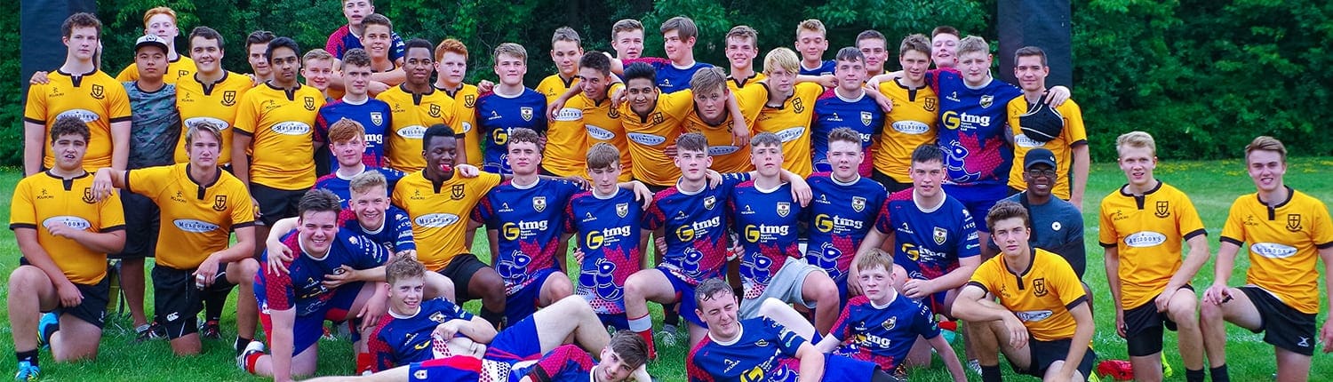 Group photo of Crusaders Rugby Club Oakville players wearing yellow and purple jerseys on a grassy field. Group photo of Crusaders Rugby Club Oakville players wearing yellow and purple jerseys on a grassy field.