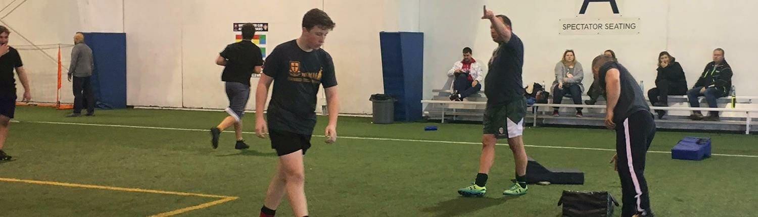 Indoor rugby practice at Crusaders Rugby Club in Oakville, with players in black jerseys on artificial turf. Indoor rugby practice at Crusaders Rugby Club in Oakville, with players in black jerseys on artificial turf.
