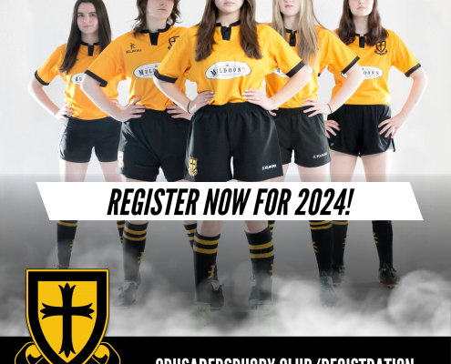 Six female rugby players in yellow jerseys pose with hands on hips, with a “REGISTER NOW FOR 2024” banner and the Crusaders Rugby Club logo visible.