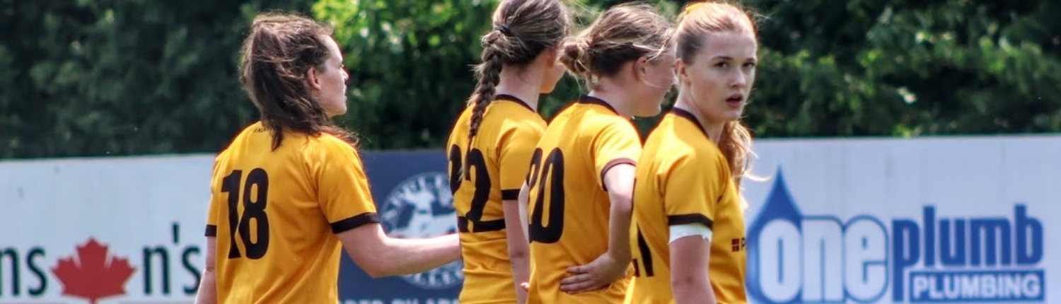 Crusaders Rugby Club players in yellow uniforms line up on a rugby field in Oakville.